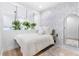 Comfortable bedroom featuring a plush rug, full bed, decorative wallpaper and mirror at 3120 Godby Rd # 1118, Atlanta, GA 30349