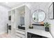 Well-designed closet with open shelving, clothing racks, and a small desk area at 3120 Godby Rd # 1118, Atlanta, GA 30349