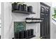 Stylish hallway shelves featuring decorative kitchen containers and plants at 3120 Godby Rd # 1118, Atlanta, GA 30349