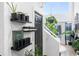 Hallway with plants, decor, and shelving near stairwell and exterior door at 3120 Godby Rd # 1118, Atlanta, GA 30349