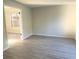 Serene bedroom with light-colored walls and wood-look flooring at 4578 Carriage Park Dr, Lithonia, GA 30038