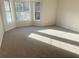 Bright bedroom with large windows and neutral carpeting at 4578 Carriage Park Dr, Lithonia, GA 30038