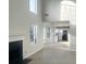 Bright living room featuring a fireplace and an open concept to the kitchen at 4578 Carriage Park Dr, Lithonia, GA 30038