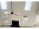 Sun-drenched living room with a ceiling fan and neutral paint at 4578 Carriage Park Dr, Lithonia, GA 30038