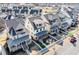 Aerial view of attractive homes with manicured lawns, charming picket fences, and inviting front porches in a friendly neighborhood at 561 S Club Dr, Woodstock, GA 30188