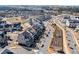 Wide aerial view of a beautifully planned community with well-maintained homes, lush greenery, and meandering streets at 561 S Club Dr, Woodstock, GA 30188