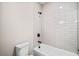 Modern bathroom featuring a white tiled shower/tub combo with matte black fixtures at 561 S Club Dr, Woodstock, GA 30188
