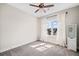 Bright bedroom with carpet, ceiling fan, window with curtains and a white storage cabinet at 561 S Club Dr, Woodstock, GA 30188
