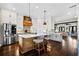 Open kitchen featuring a large island with seating and stainless steel appliances and fixtures at 561 S Club Dr, Woodstock, GA 30188