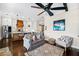 Cozy living room adjacent to the kitchen, featuring stylish decor and comfortable seating at 561 S Club Dr, Woodstock, GA 30188