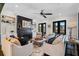 Bright living room with hardwood floors, fireplace, built-in shelving, and comfortable seating, perfect for relaxation and entertaining at 561 S Club Dr, Woodstock, GA 30188