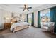 Spacious main bedroom features plush carpeting, ceiling fan and window views at 561 S Club Dr, Woodstock, GA 30188