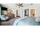 Spacious main bedroom features plush carpeting, ceiling fan and ensuite bathroom at 561 S Club Dr, Woodstock, GA 30188