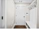 Mud room with hardwood floors, coat hooks, and a bench with storage baskets at 561 S Club Dr, Woodstock, GA 30188