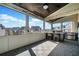 Relaxing outdoor patio with built-in grill, bar seating and neighborhood views at 561 S Club Dr, Woodstock, GA 30188