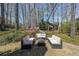 Outdoor patio with comfortable seating and wooded views at 1201 Lake Washington Dr, Lawrenceville, GA 30043