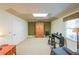 Spacious basement featuring a drop ceiling, carpeting, a window, and space for a piano or music setup at 1201 Lake Washington Dr, Lawrenceville, GA 30043