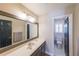 Bright bathroom with a large mirror, double vanity, and a separate toilet room at 1201 Lake Washington Dr, Lawrenceville, GA 30043