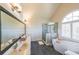 Bright bathroom featuring double sinks, soaking tub and glass enclosed shower at 1201 Lake Washington Dr, Lawrenceville, GA 30043