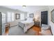 Cozy bedroom with hardwood floors, neutral colors, and natural light from a window at 1201 Lake Washington Dr, Lawrenceville, GA 30043