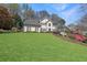 Charming two-story traditional home with manicured front lawn and colorful azaleas at 1201 Lake Washington Dr, Lawrenceville, GA 30043