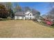 Beautiful two-story home with a well-manicured lawn and landscaping, including blossoming azaleas at 1201 Lake Washington Dr, Lawrenceville, GA 30043