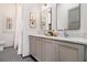 Bright bathroom with double vanity, marble counters, and classic mirrors at 220 3Rd St, Fayetteville, GA 30214