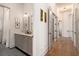 Hall bathroom with gray vanity, double sinks, and patterned floor at 220 3Rd St, Fayetteville, GA 30214