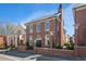 Charming red brick home featuring a classic design, manicured landscaping, and a welcoming entrance at 220 3Rd St, Fayetteville, GA 30214