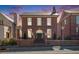 Charming red brick home featuring a classic design, manicured landscaping, and a welcoming entrance at 220 3Rd St, Fayetteville, GA 30214