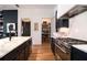 Stylish kitchen featuring stainless steel appliances, granite countertops, and a walk-in pantry at 220 3Rd St, Fayetteville, GA 30214