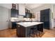 Modern kitchen with stainless steel appliances, a center island, and sleek cabinetry and countertops at 220 3Rd St, Fayetteville, GA 30214