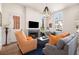 Bright and airy living room with a fireplace, modern furnishings, and ample natural light at 220 3Rd St, Fayetteville, GA 30214