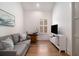 Cozy home office with hardwood floors, sofa, and natural light at 220 3Rd St, Fayetteville, GA 30214