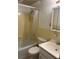Simple bathroom featuring a shower/tub combo, yellow tile, and a white vanity at 300 Peachtree Ne St # 9A, Atlanta, GA 30308
