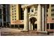 View of the Milton building with an ornate column-lined entrance at 300 Peachtree Ne St # 9A, Atlanta, GA 30308