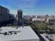 City view from an enclosed balcony featuring buildings and skyline beyond a window screen at 300 Peachtree Ne St # 9A, Atlanta, GA 30308