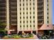Tall apartment building with balconies and flowers at 300 Peachtree Ne St # 9A, Atlanta, GA 30308