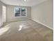 The bedroom boasts carpet flooring and natural light at 2555 Flat Shoals Rd # 3405, Atlanta, GA 30349