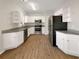 Well-lit kitchen with white cabinets, stainless steel appliances, and granite countertops at 2555 Flat Shoals Rd # 3405, Atlanta, GA 30349