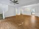 Spacious living room with ceiling fan and lovely wood floors and a grand chandelier at 2555 Flat Shoals Rd # 3405, Atlanta, GA 30349