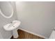 This powder room features a pedestal sink and modern fixtures at 2555 Flat Shoals Rd # 3405, Atlanta, GA 30349