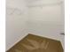 An organized walk-in closet with ample shelving at 2555 Flat Shoals Rd # 3405, Atlanta, GA 30349