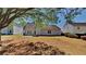 Spacious backyard has a covered patio area perfect for relaxing and enjoying the outdoors at 3035 Sherbourne Dr, Lithonia, GA 30058