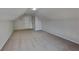 Large bonus room has neutral carpet, vaulted ceilings, recessed lighting, and access to closet space at 3035 Sherbourne Dr, Lithonia, GA 30058