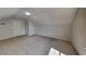 Neutral bonus room has neutral carpet, vaulted ceilings, recessed lighting, and access to closet space at 3035 Sherbourne Dr, Lithonia, GA 30058