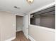 Basement area with laminate flooring and view to the garage through window at 2780 Creekwood Ln, Lawrenceville, GA 30044