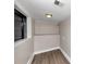 Basement room with laminate flooring, and view of garage through a window at 2780 Creekwood Ln, Lawrenceville, GA 30044