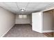 Finished basement area with carpet, window and open doorway at 2780 Creekwood Ln, Lawrenceville, GA 30044