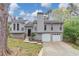 Charming two-story home with a two-car garage, gray siding, and well-manicured lawn at 2780 Creekwood Ln, Lawrenceville, GA 30044